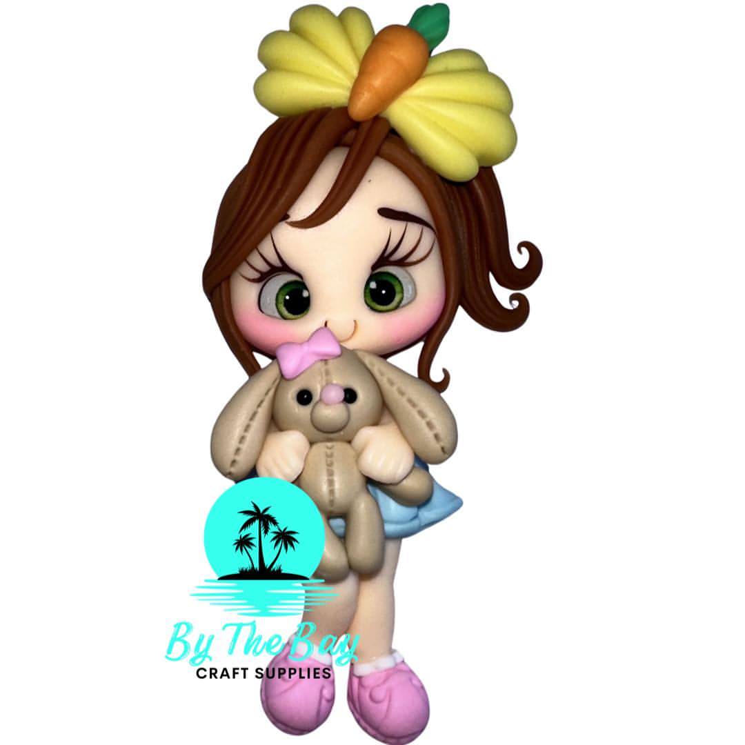 Girl with carrot bow and brown bunny