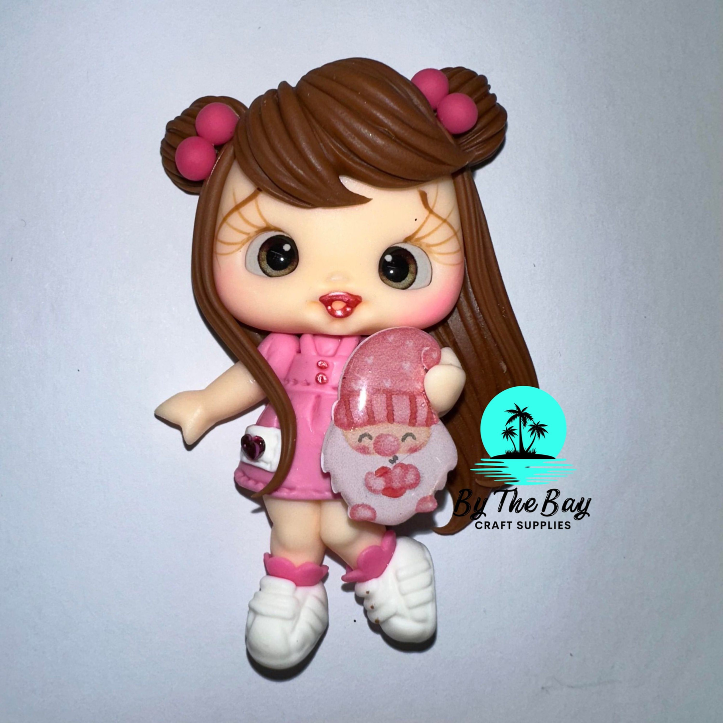 Girl with little Christmas gnome