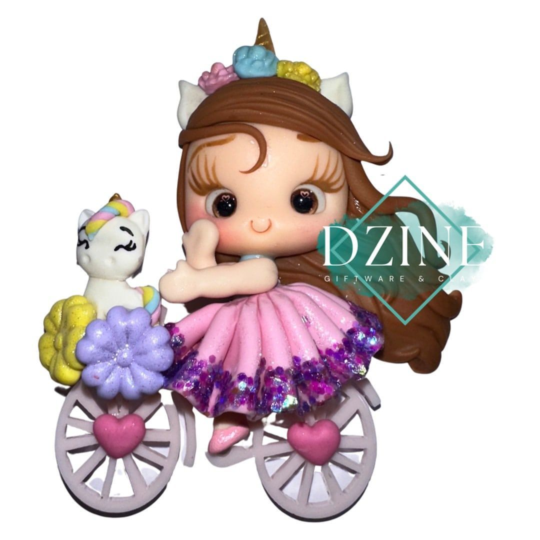 Cute girl on bike with unicorn