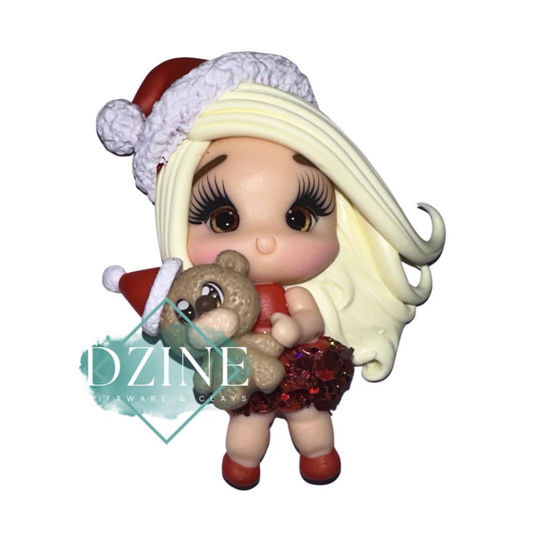 Christmas cute blonde girl with bear
