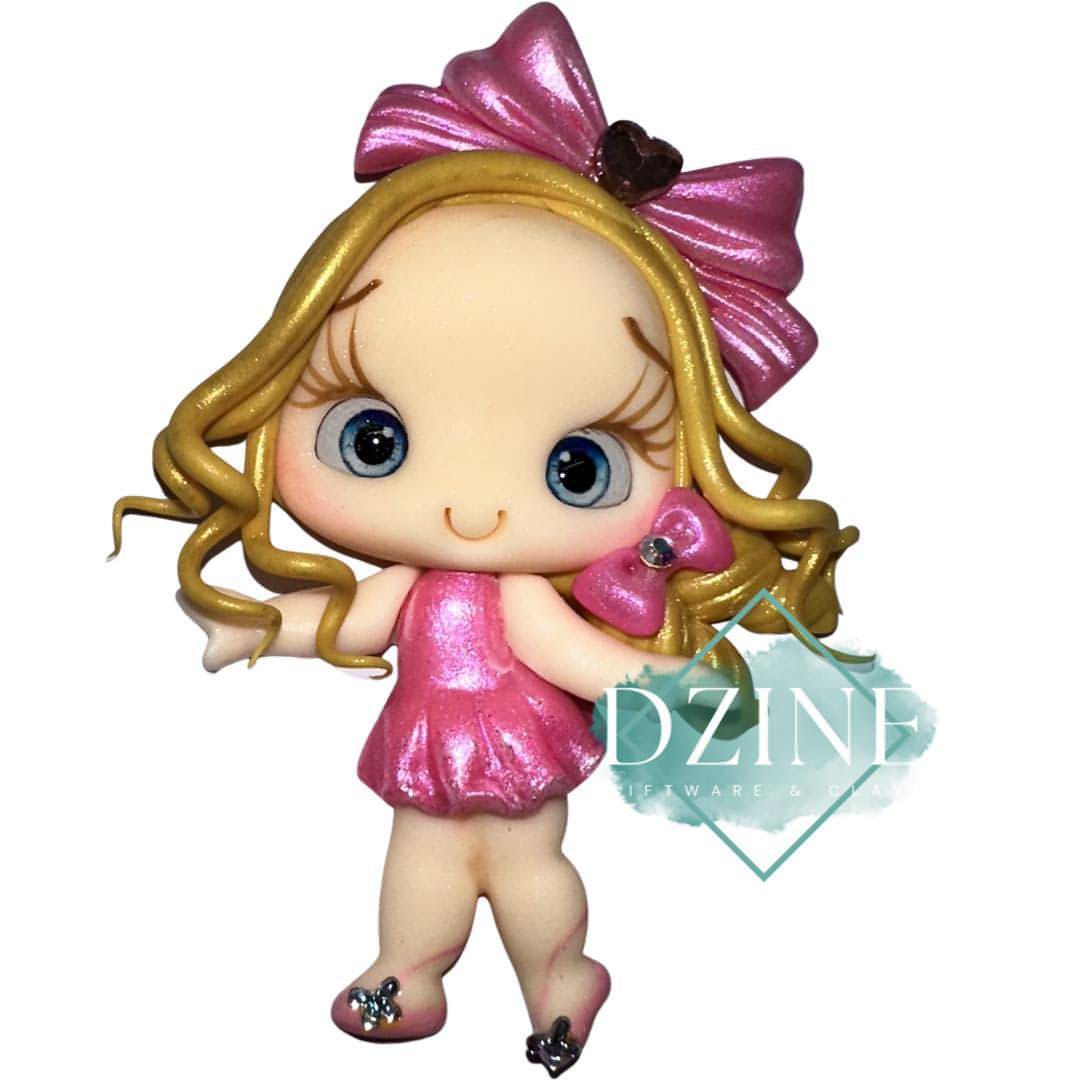 Cute girl with Pink dress & bow in hair