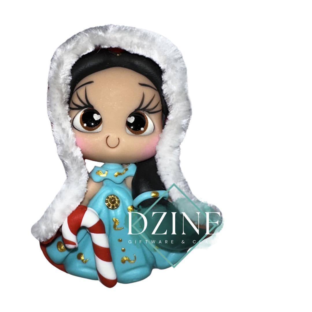 Christmas genie wearing fluffy cape