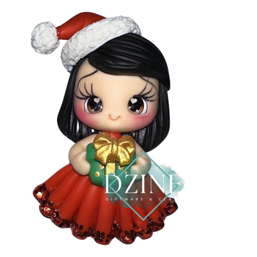 Cute Christmas girl holding present