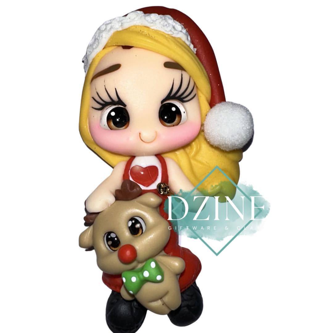 Cute Christmas girl wearing love heart shirt with reindeer blonde hair