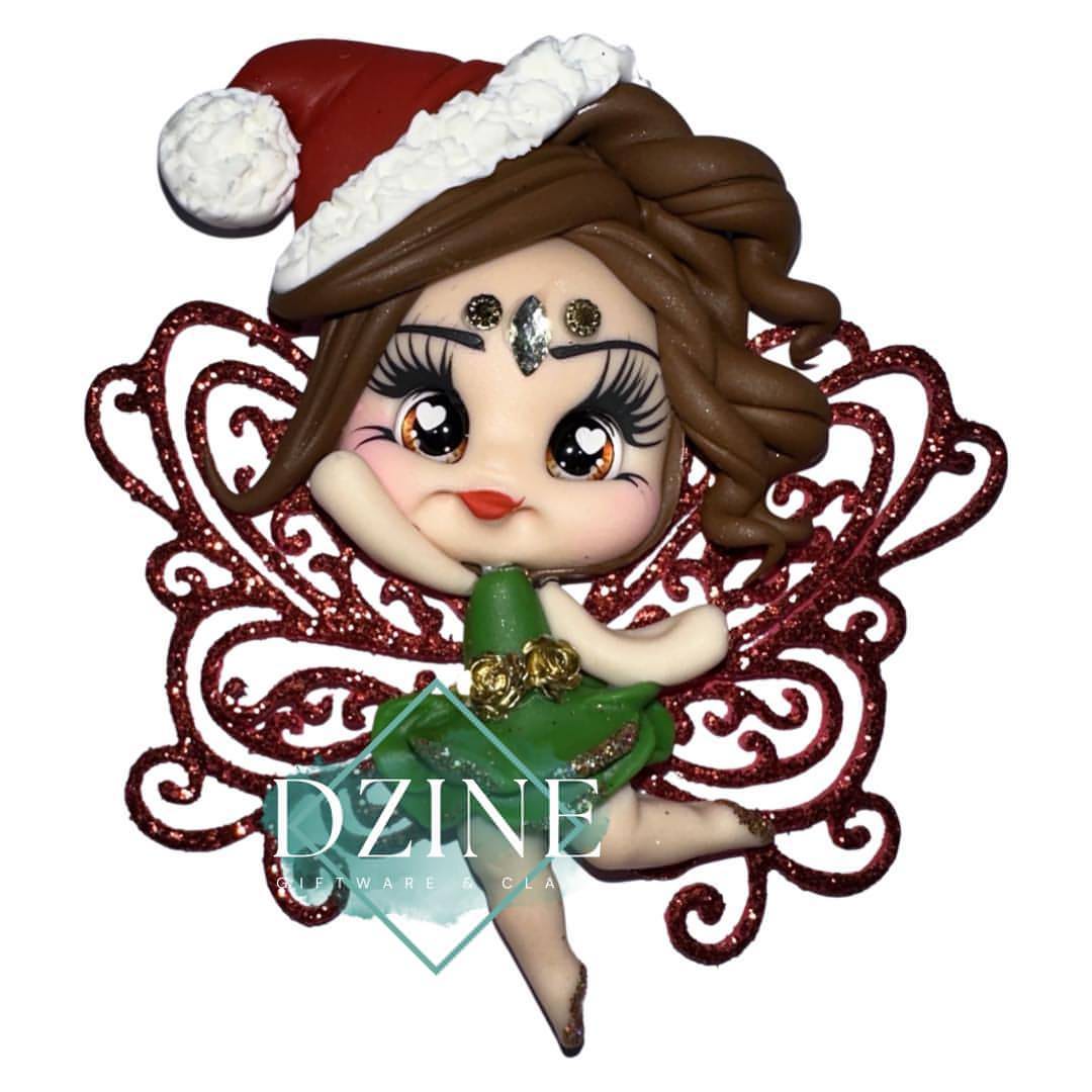 Christmas fairy with red glitter wings