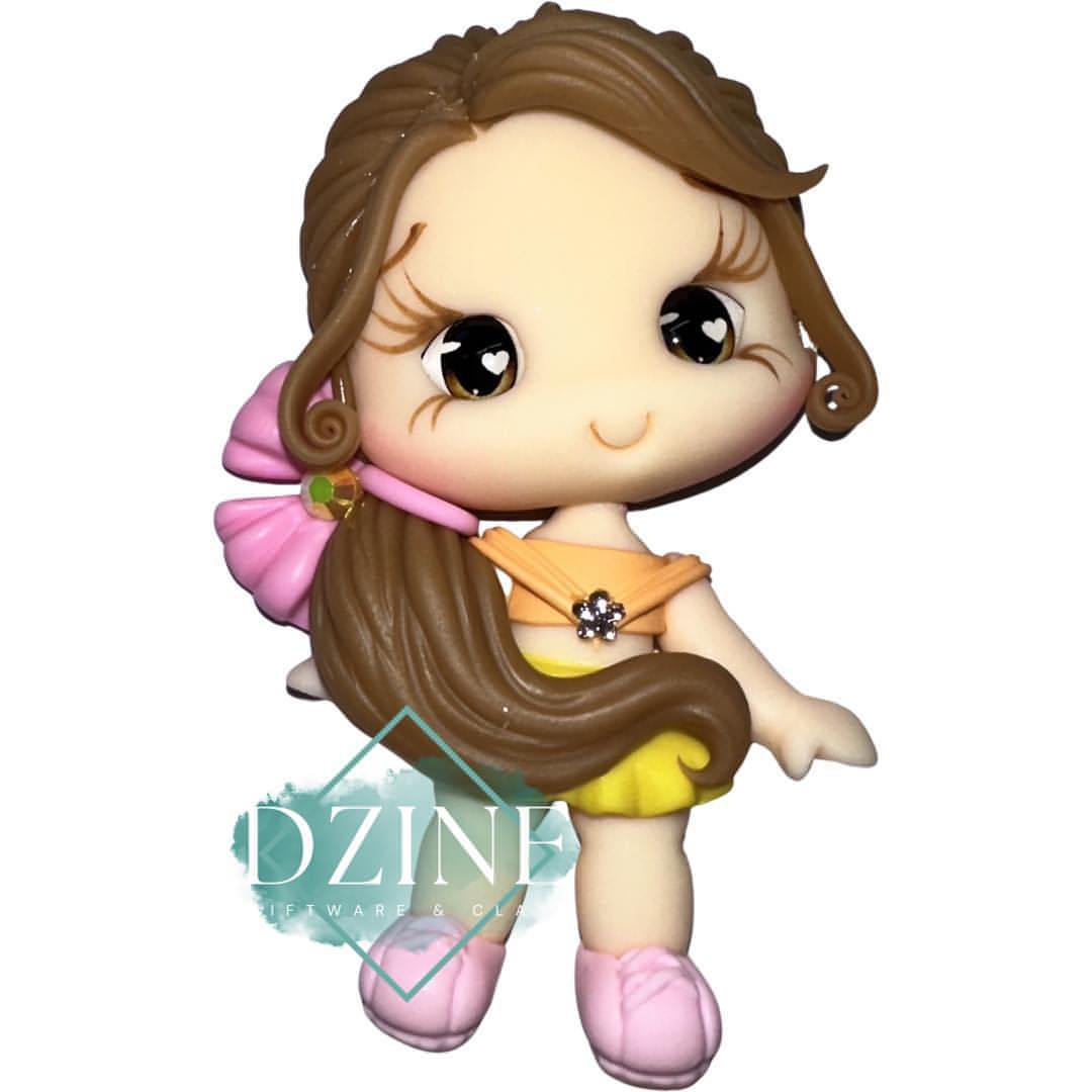 Cute girl in Orange top yellow skirt