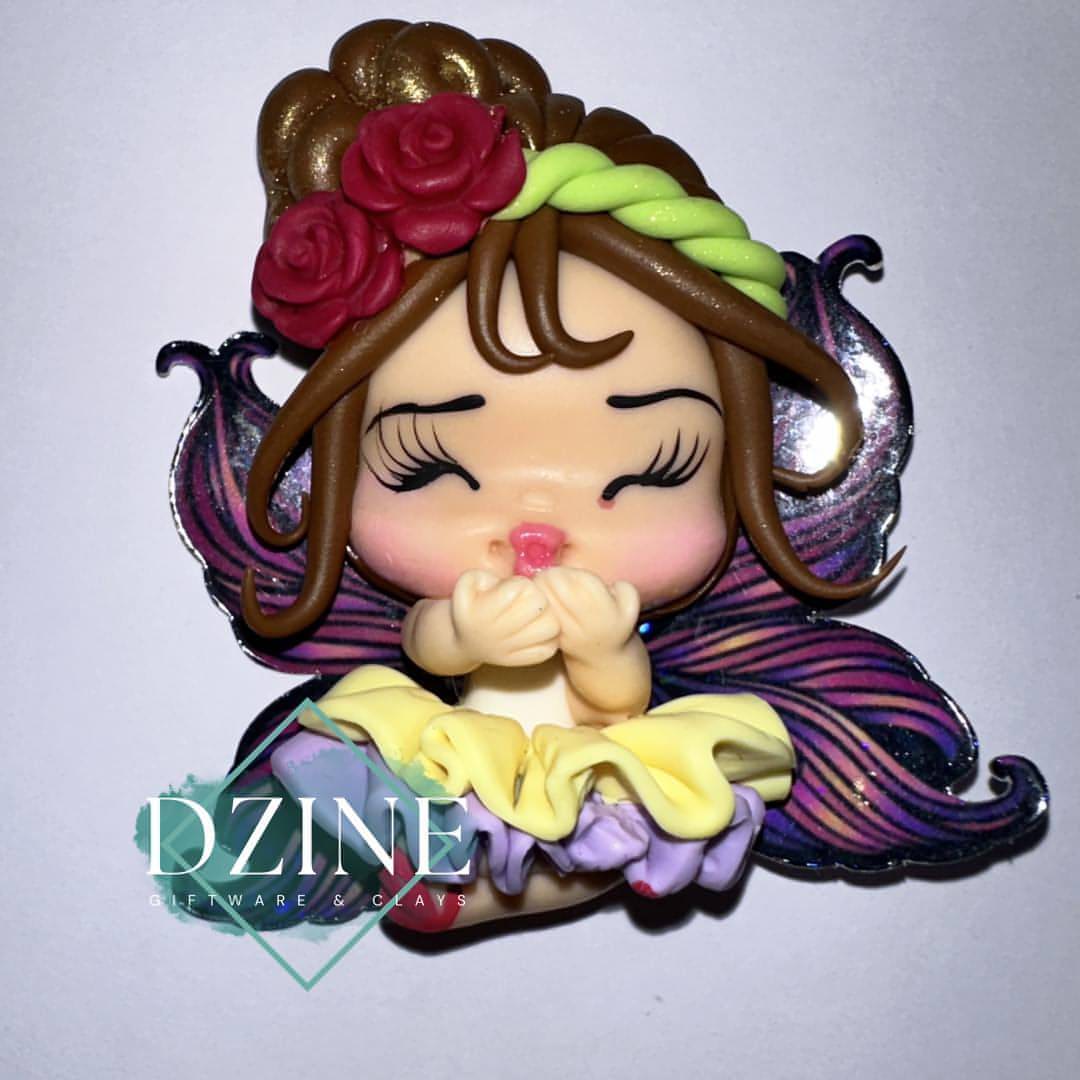 Fairy with purple and yellow skirt