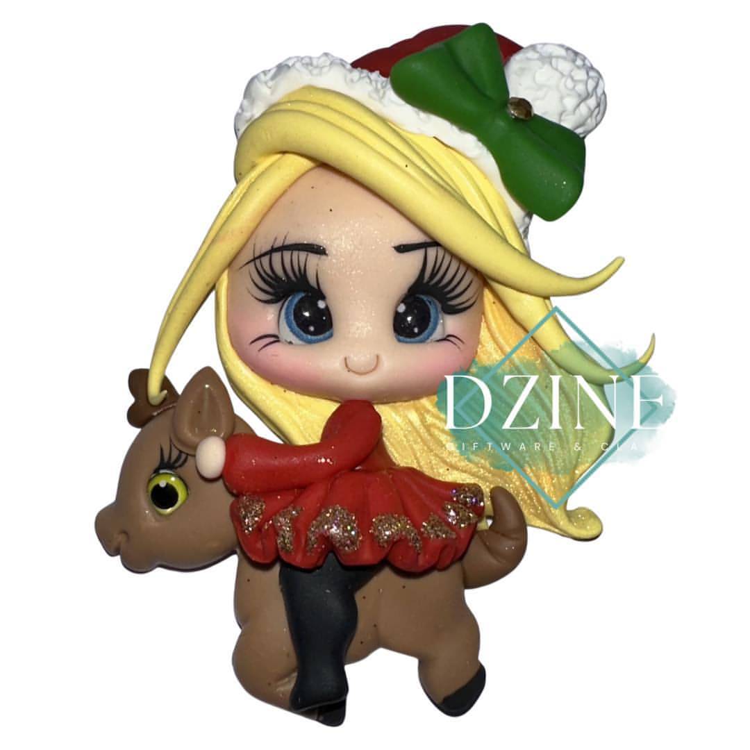 Christmas girl on reindeer with blonde hair
