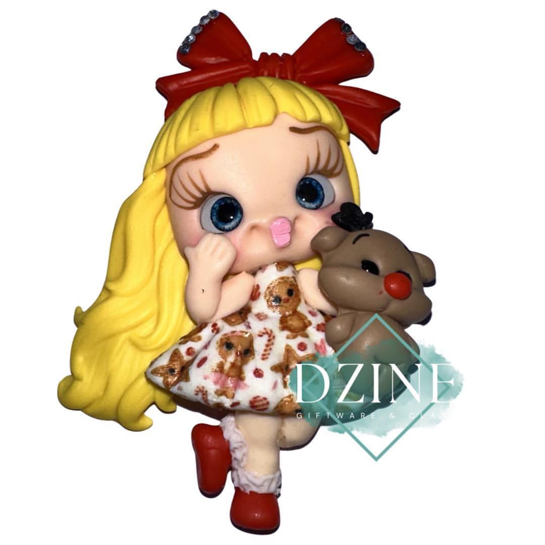Christmas girl in reindeer dress with reindeer blonde hair