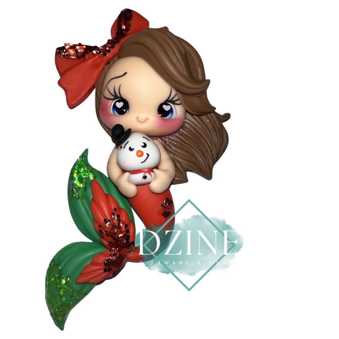 Christmas mermaid holding snow man