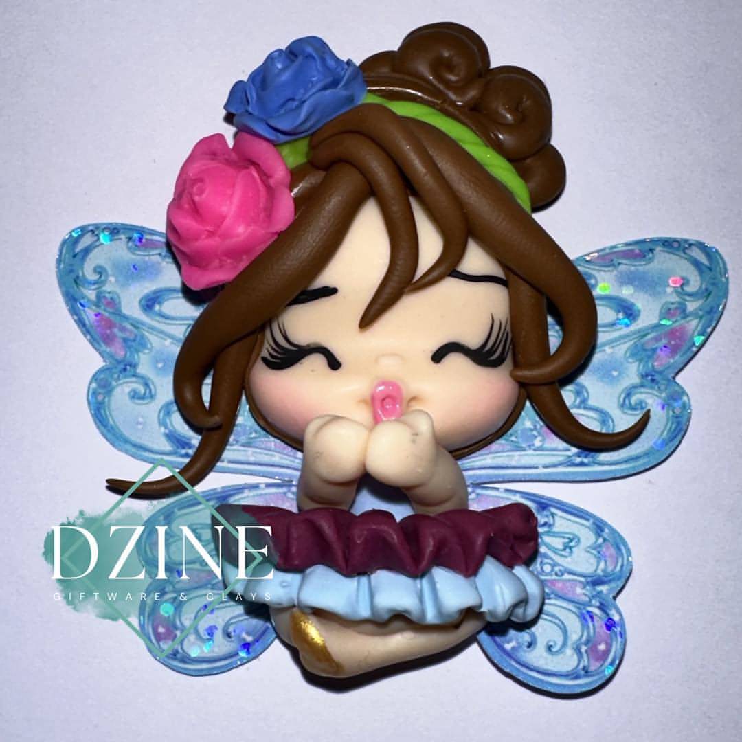 Fairy with blue and maroon skirt