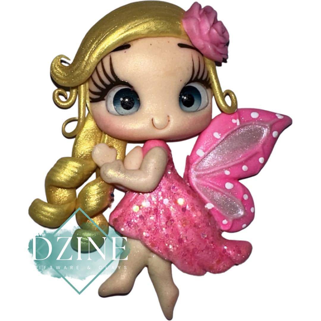 Fairy with pink wings and gold hair