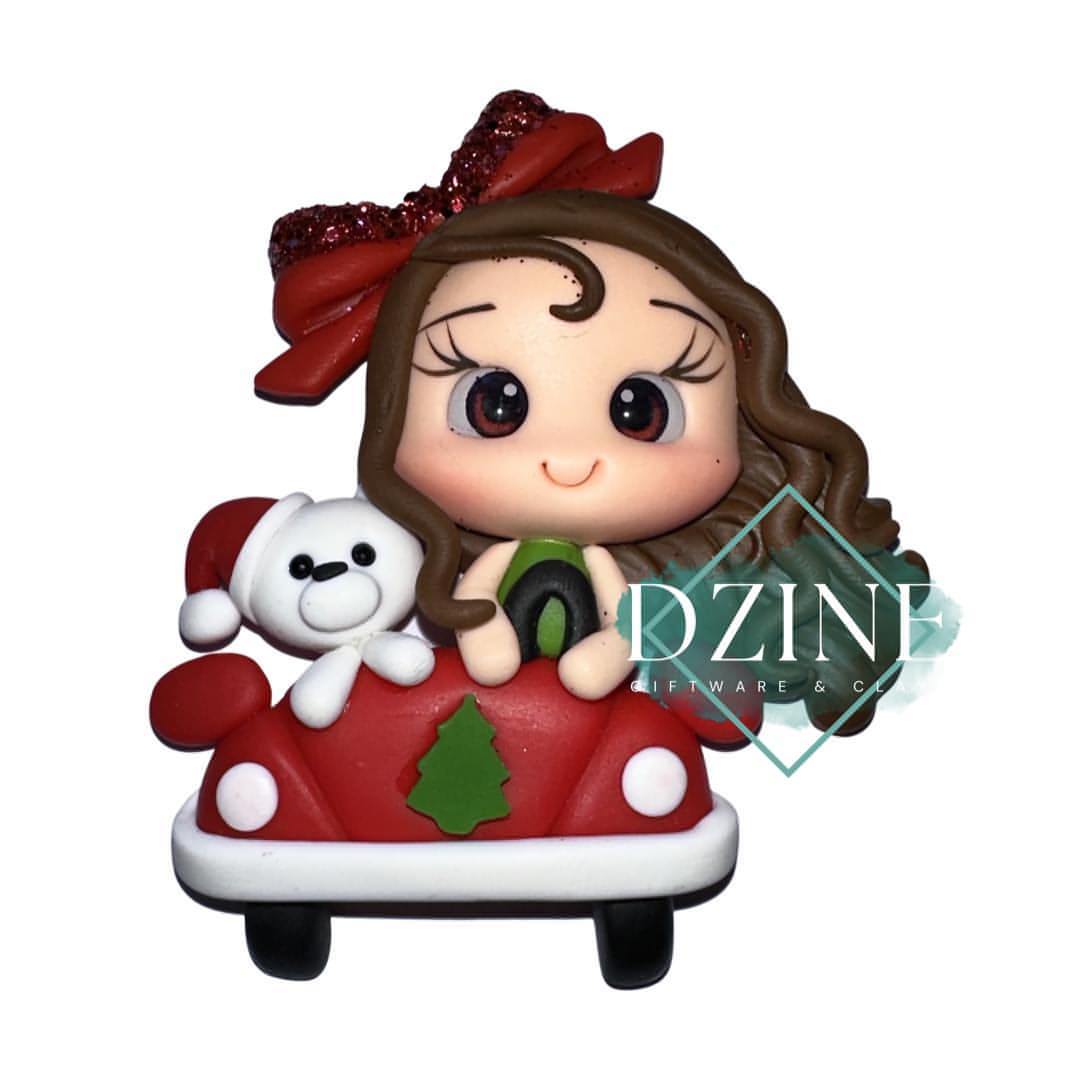 Christmas girl in car with bear