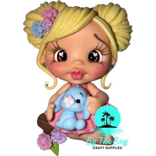 Sitting girl with blue bunny