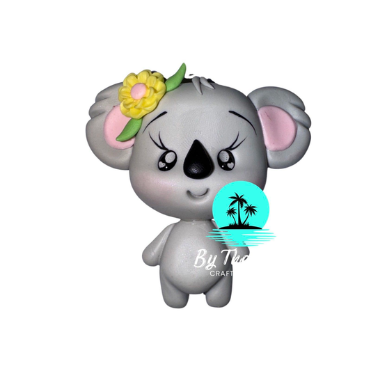 Koala with yellow flower