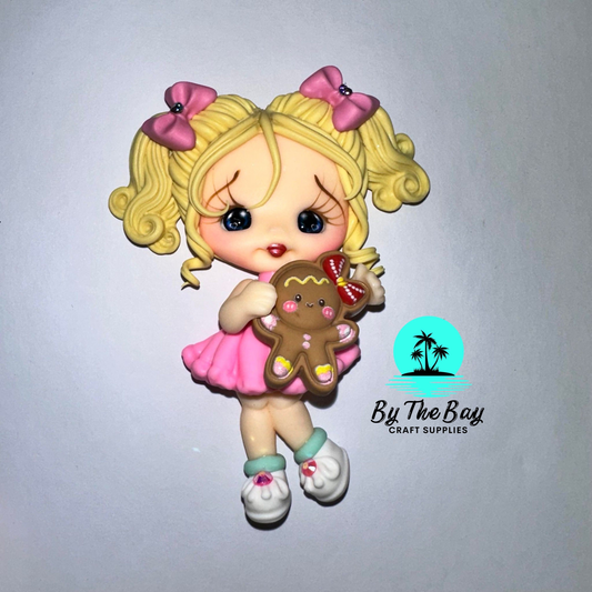 Blonde girl with gingerbread