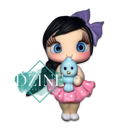 Cute girl with blue bird pink polka dress