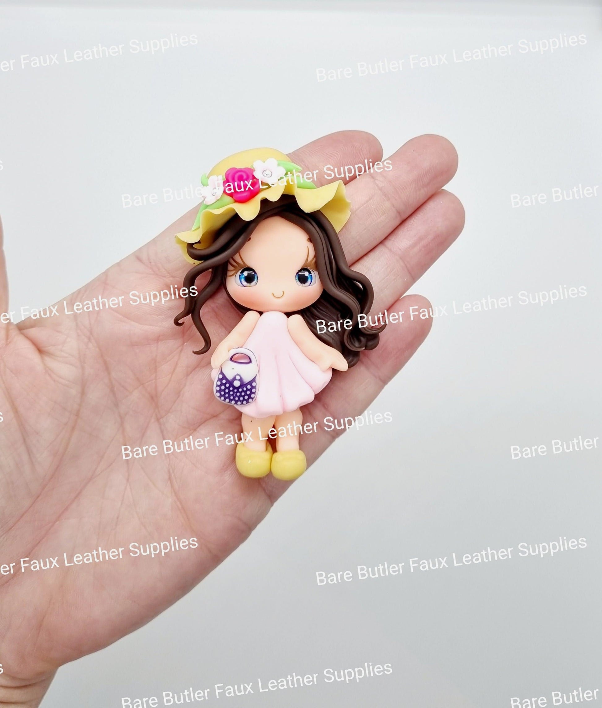 Girl Holding Purse with a Yellow Sun Hat - Bare Butler Faux Leather Supplies 