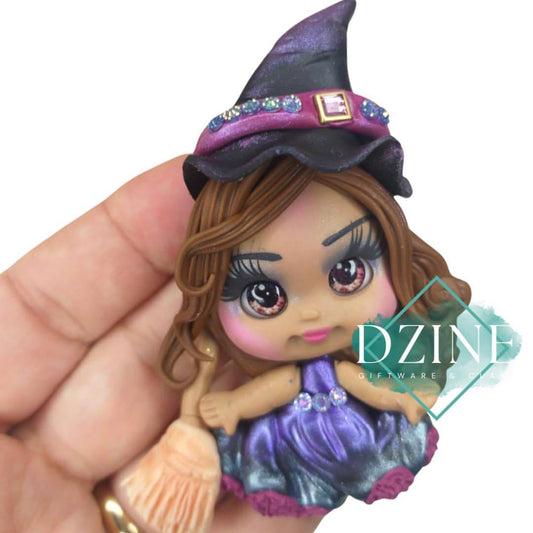 Witch on broom in purple dress