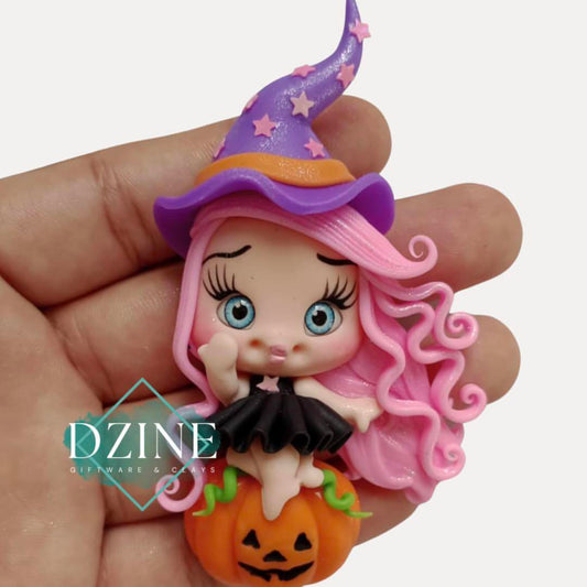 Cute witch on pumpkin