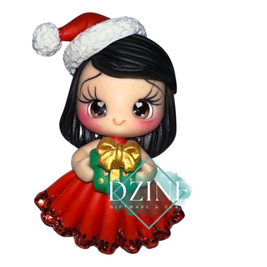 Cute Christmas girl holding present