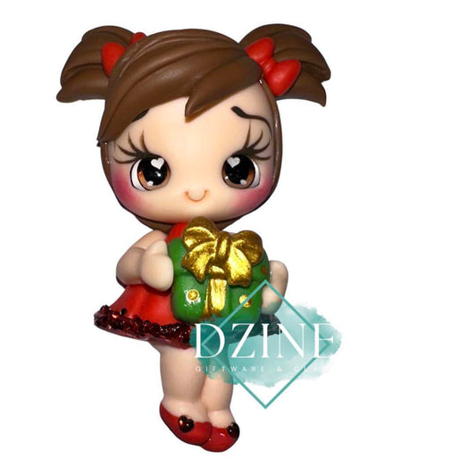Cute Christmas brunette girl holding pressie