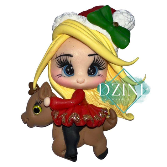 Christmas girl on reindeer with blonde hair